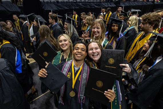 students celebrating at a commencement ceremony