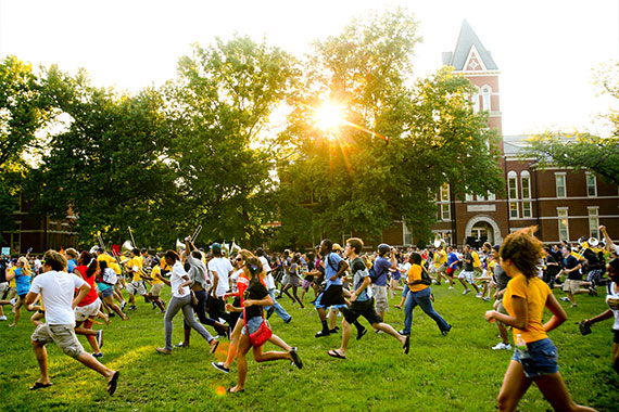 First year students running through the Columns during Tiger Walk