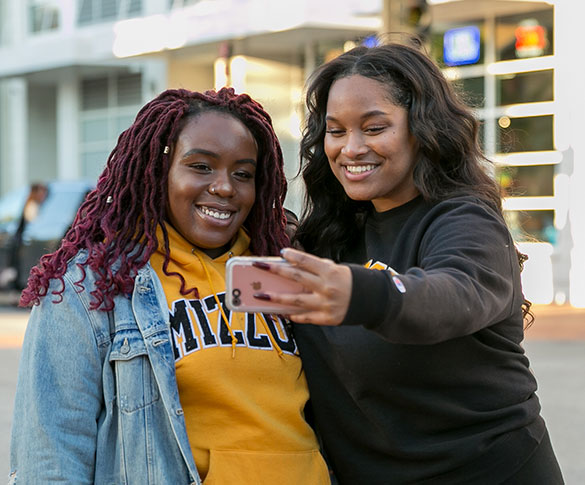 Two women taking a selfie in downtown Columbia