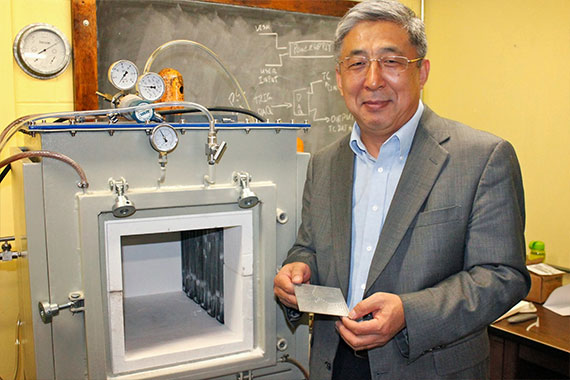 Professor Bill Ma with his invention