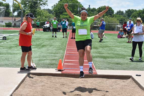 Athlete does the long jump in the Special Olympics