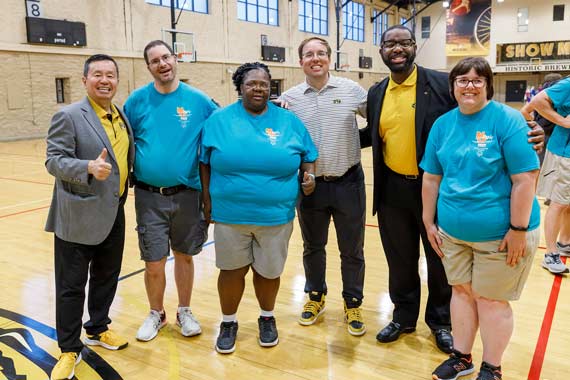 President Choi, Coach Drinkwitz, Maurice Gipson and Special Olympics athletes