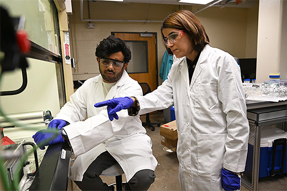 Maryam Salehi and student in a lab