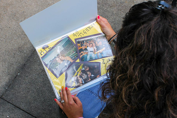 Woman looks at scrapbook