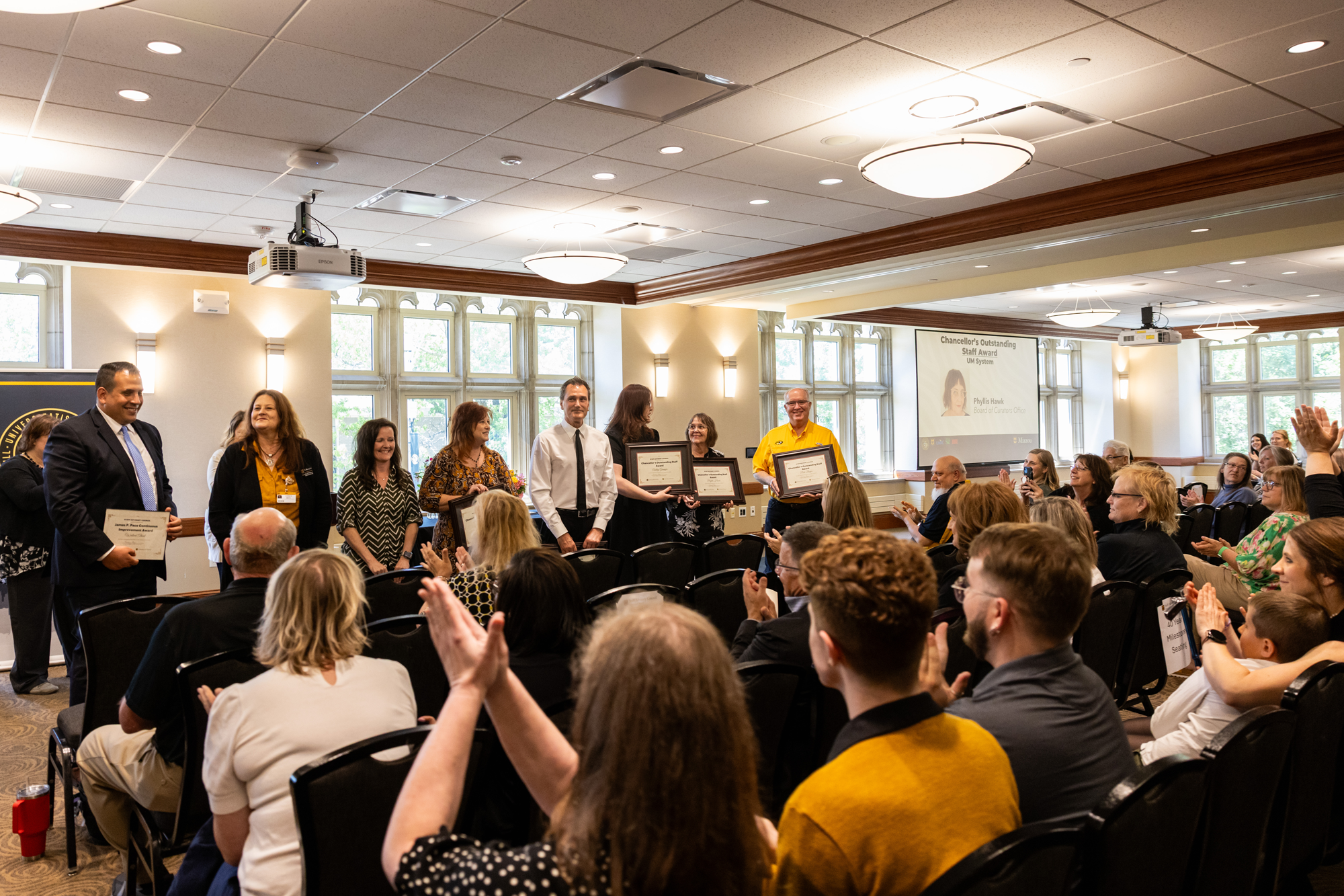 Staff members at ceremony
