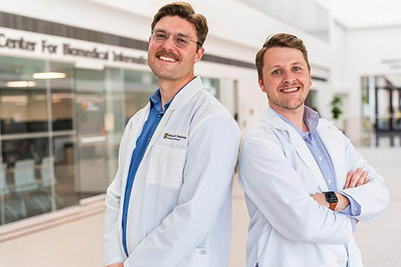 Photo of two medical students in white coats