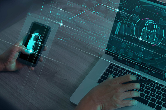 Smartphone and laptop screens both showing futuristic images