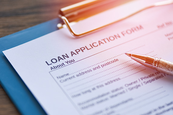 Loan application form on a clipboard