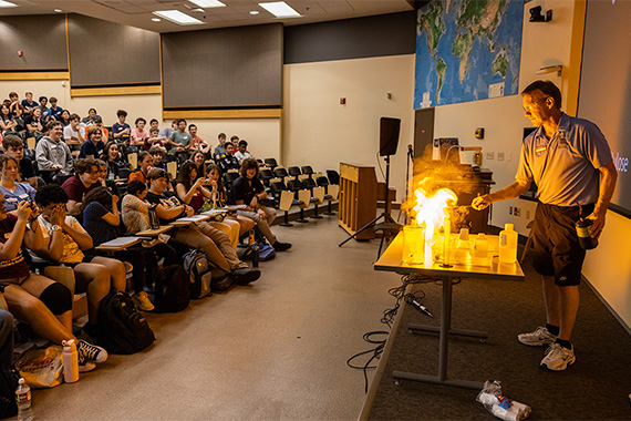 Presenter showing fire to a classroom full of students