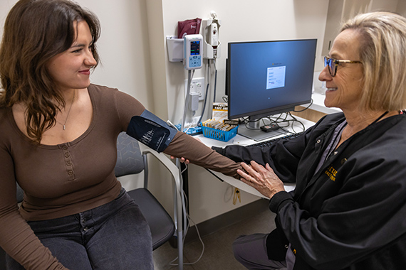 Student getting blood pressure checked