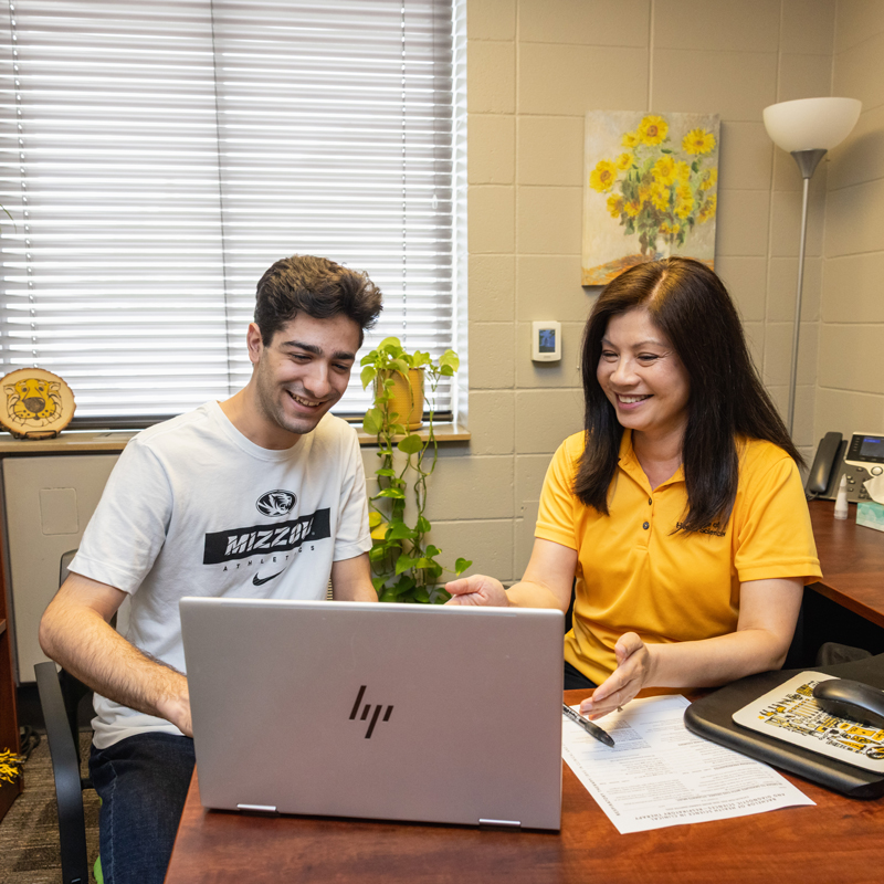 Financial advisor working with a student