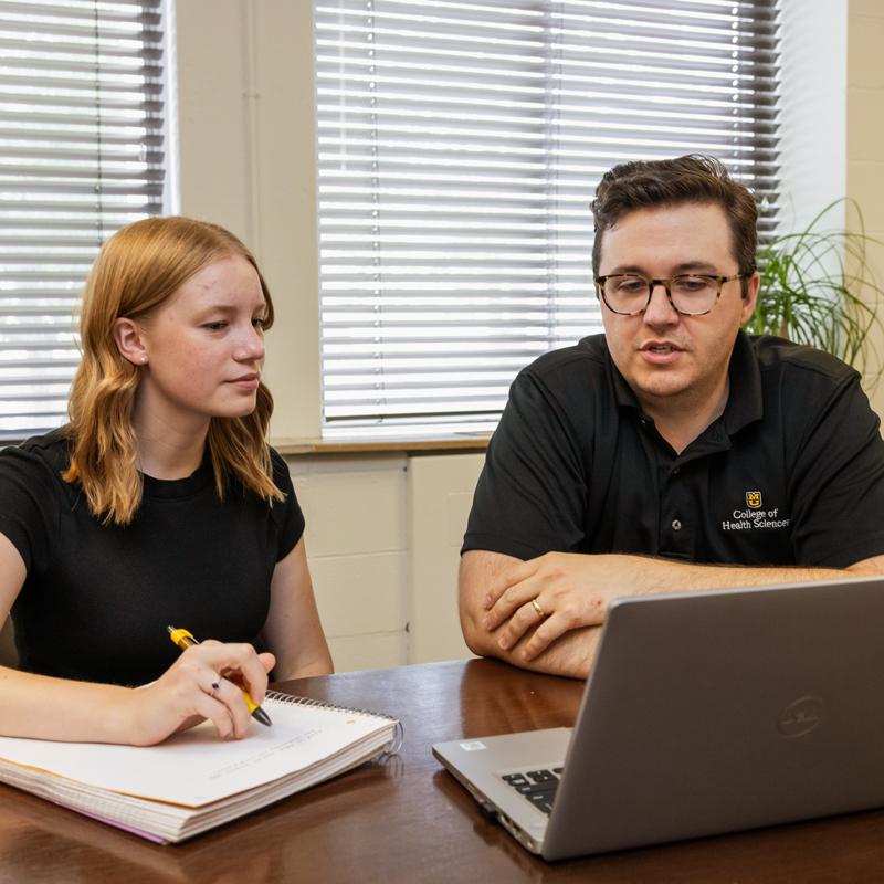 Financial advisor working with a student