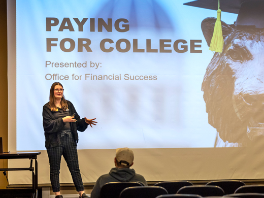 Staff member giving a presentation on how to pay for college