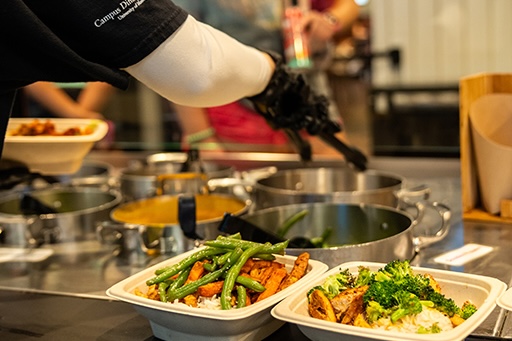 Food bar with full plates in the foreground