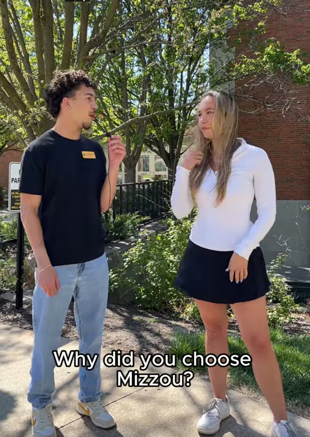 A Mizzou tour guide asking a female student Why did you choose Mizzou