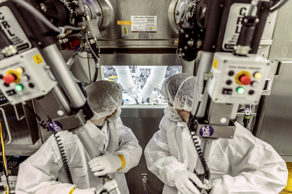 People in white coats at the MU research reactor (MURR)