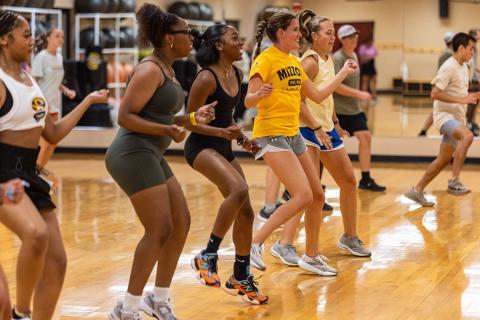 Students exercising in a gym